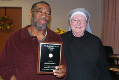 With Mother Mary Vincent, Mark Council holds his Jeanne Jugan Award